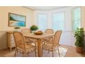 Sunlit dining area features a table, seating for four, and natural light at 1166 Memory Ln, Lawrenceville, GA 30044