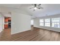 Bright living room with hardwood floors and many windows showcasing natural light at 2416 Centennial Hill Nw Way, Acworth, GA 30102