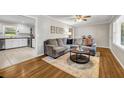Cozy living room featuring a comfortable sectional sofa, area rug and stylish decor at 2396 Midvale Cir, Tucker, GA 30084