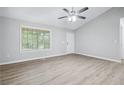 Bright bedroom with vaulted ceilings, large window, and contemporary flooring for a modern look at 21 Misty Hollow Ct, Euharlee, GA 30145