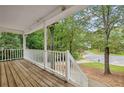 View from the porch overlooking lush greenery, enhancing the outdoor living space at 21 Misty Hollow Ct, Euharlee, GA 30145