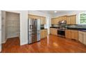 Eat-in kitchen features stainless steel appliances, granite countertops and pantry at 225 Bayswater Dr, Suwanee, GA 30024