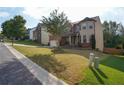 Two-story home with brick and siding exterior, manicured lawn, two-car garage, and landscaped yard at 3770 Falling Leaf Ln, Cumming, GA 30041