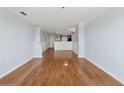 Open living area with hardwood floors leading to kitchen at 795 Hammond Dr # 2101, Atlanta, GA 30328