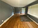 Bright living room featuring polished hardwood floors, natural light, and access to outdoor space at 2273 Childress Dr, Atlanta, GA 30311
