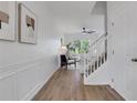 Bright foyer with hardwood floors and staircase leading to the upper level at 3552 Clear Creek Nw Xing, Kennesaw, GA 30144