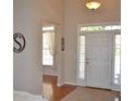 Bright entryway with wood floors, transom windows, and views into other rooms at 40 Templeton Ln, Villa Rica, GA 30180
