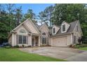 Charming home showcasing stone and siding, a two-car garage, and a well-manicured lawn at 40 Templeton Ln, Villa Rica, GA 30180