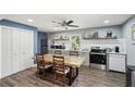Inviting kitchen with stainless steel appliances, sleek countertops, and a spacious dining area at 2015 Cascade Sw Rd, Atlanta, GA 30311
