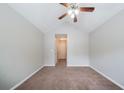 Bedroom with vaulted ceiling, carpet, neutral walls and fan at 3777 Oakland Spring Ct, Snellville, GA 30039