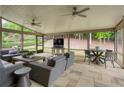 Relaxing screened-in sunroom featuring comfortable seating and outdoor views for comfortable living at 5250 Briarstone Ridge Way, Alpharetta, GA 30022