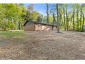 Brick ranch-style home is set amongst lush trees on a spacious lot at 622 Saddlewood Dr, Lawrenceville, GA 30043