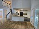 Open-concept kitchen with granite countertops and stainless steel appliances at 815 Alta Ct, Lithonia, GA 30058