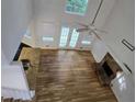 Spacious living room with hardwood floors, fireplace, and natural light at 815 Alta Ct, Lithonia, GA 30058