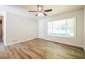 Bright living room boasts wood-look floors, neutral walls and ample natural light at 1237 Gale Dr, Norcross, GA 30093