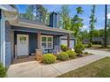 Inviting front porch with rocking chairs and stylish decor, perfect for relaxing outdoors at 60 Water Oak Trl, Covington, GA 30014