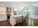 Bright kitchen featuring white cabinets, stainless steel appliances, and a spacious island with bar seating at 2795 Autumn Dr, Canton, GA 30115