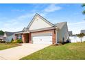 Well-maintained home exterior with a brick facade and attached two-car garage at 806 Village Pl, Loganville, GA 30052