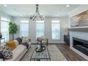 Comfortable living room with a fireplace, plenty of natural light, and modern furnishings at 113 Iveybrooke Ln # 61, Alpharetta, GA 30009