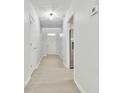 Bright hallway with fresh paint, new flooring, and access to the home's interior spaces at 6125 Brookechase Ln, Norcross, GA 30093