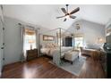 Spacious bedroom with vaulted ceilings, a four-poster bed, and abundant natural light at 15 Swallow Se Dr, White, GA 30184