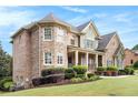 Charming home with stone and siding, showcasing manicured landscaping and a welcoming front entrance at 3820 Preserve Crossing Ln, Cumming, GA 30040