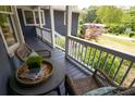 Inviting front porch featuring a seating area with a small table and wicker chairs at 126 N Barton St, Norcross, GA 30071