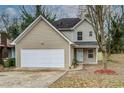 A two-story home with a two-car garage and neat, well-maintained landscaping at 1526 Venetian Sw Dr, Atlanta, GA 30311