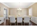 Formal dining room with hardwood floors, white wainscoting, and seating for eight at 2794 Kakki Ct, Marietta, GA 30062