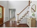 Bright entryway with hardwood floors, staircase, and stylish decor at 2794 Kakki Ct, Marietta, GA 30062