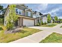 Charming street view showcasing the home's manicured lawn, driveway, and neighborhood setting at 311 Wells Cir, Canton, GA 30114