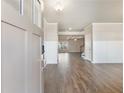 Inviting foyer with hardwood floors, paneling and views into the living space at 632 Eagles Nest Cir, Auburn, GA 30011