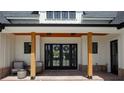 Charming front porch with wood pillars, brick accents, double doors, and decorative wreaths at 247 Terrace View Dr, Acworth, GA 30101