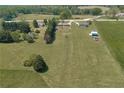 An aerial shot showcases the property and land, with plenty of room for activities at 14807 Highway 36, Covington, GA 30014