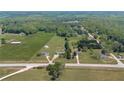 Scenic aerial view of homes with lush green surroundings and agricultural land at 14807 Highway 36, Covington, GA 30014
