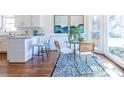 Cozy breakfast nook with a glass top table, stylish chairs, and a view of the backyard at 883 Heritage Pl, Decatur, GA 30033