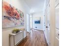 Inviting hallway with hardwood floors, white trim, and decorative artwork, creating an elegant ambiance at 883 Heritage Pl, Decatur, GA 30033