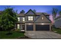 Beautiful two-story home with a well-manicured lawn, two-car garage and a brick facade at 6435 Privet Way, Cumming, GA 30028