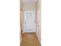 Inviting entryway with neutral paint and a door with window pane at 6991 Bonnes Blvd, Austell, GA 30168