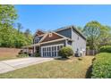 This home has a well-manicured lawn, side entry garage, and a classic home design at 1699 Boulder Walk Se Dr, Atlanta, GA 30316