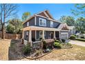 Beautiful home featuring a welcoming front porch and a well-maintained, landscaped front yard and attached garage at 1699 Boulder Walk Se Dr, Atlanta, GA 30316