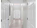Bright foyer featuring hardwood floors, soaring ceilings, and a clear view of the front door at 1029 Chaterly Ct, Riverdale, GA 30296