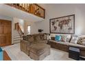 Spacious living room offering plush seating, a loft, and ample natural light at 873 Edgewater Cir, Marietta, GA 30062