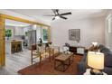 Bright living room open to the kitchen, featuring stylish furnishings and decor at 2358 Larchwood Sw Rd, Atlanta, GA 30310