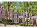 Brick townhome featuring a charming front entrance and well-maintained landscaping at 1429 Ferocity Ridge Nw Way # 12, Kennesaw, GA 30152