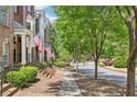 Peaceful street view of lovely townhomes and manicured front yards at 1429 Ferocity Ridge Nw Way # 12, Kennesaw, GA 30152