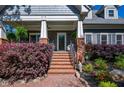 Inviting front porch with brick stairs and lush landscaping at 414 Pensdale Rd, Decatur, GA 30030