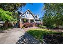 Charming home with landscaped front yard and gated driveway at 414 Pensdale Rd, Decatur, GA 30030