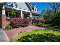Charming home with landscaped front yard and inviting porch at 414 Pensdale Rd, Decatur, GA 30030