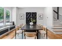Dining room featuring modern table and chairs, bright windows and hardwood floors at 4366 Skyland Ne Dr, Atlanta, GA 30342